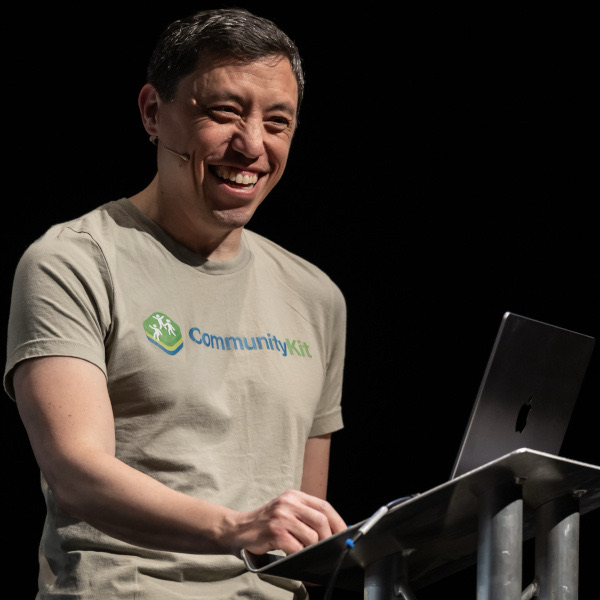 Me smiling on the Swift Leeds stage wearing a CommunityKit t-shirt.