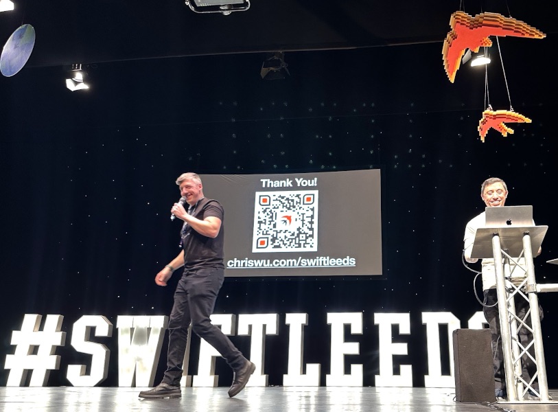 Adam walking out onto the stage as I smile at the podium.