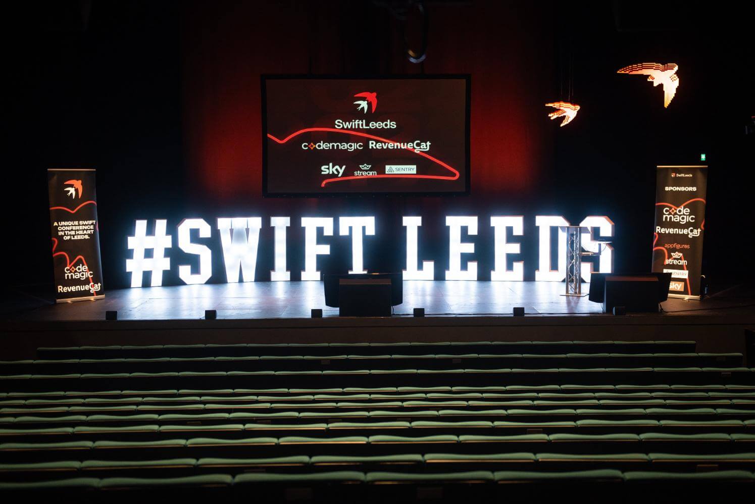 The Swift Leeds stage with a large lighted banner of the name.
