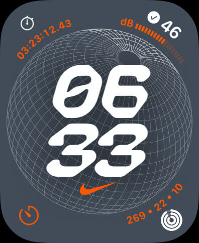 The Nike Globe watch face. It has the vertical, digital time in the center. Analog complications are on each corner.