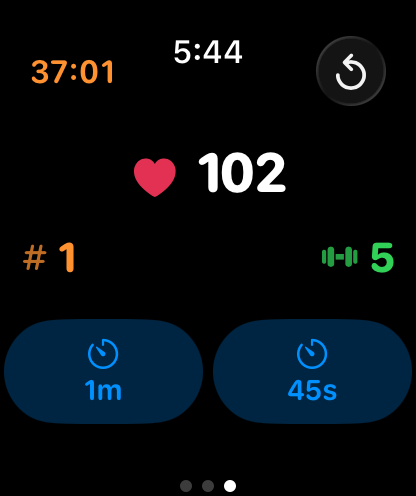 Two large counters are positioned horizontally below the heart rate. The set counter is red with a hashtag symbol and the exercise count is cyan with a dumbbell symbol. The standard rest timers are below them.