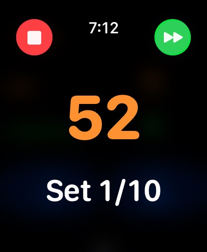 An EMOM timer showing 52 seconds left in set 1 of 10.