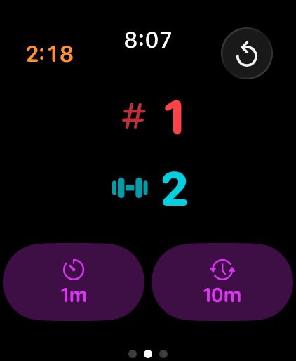 Two large counters are positioned vertically above the rest counters. The set counter is red with a hashtag symbol and the exercise count is cyan with a dumbbell symbol.